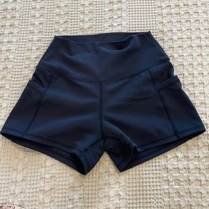 curves and combatboots black booty scrunch shorts